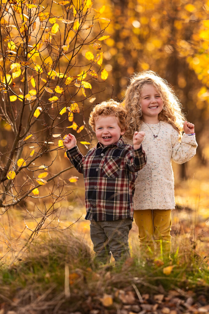 Children having lots of fun during family autumn photoshoot in Glasgow.