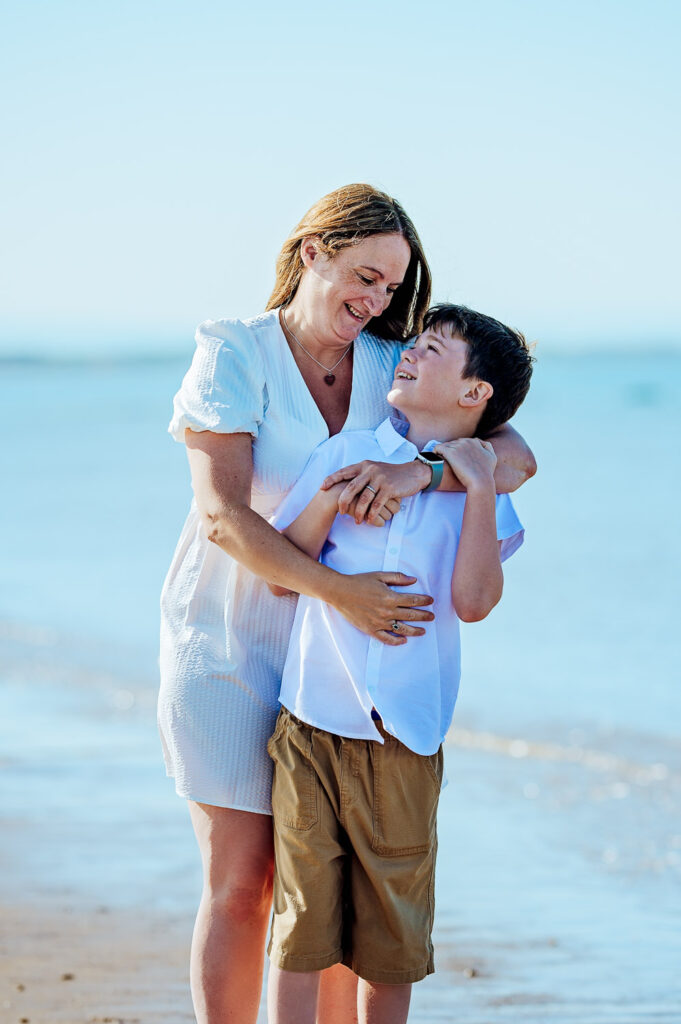 Mum holding her son during a family photoshoot on the beach in Irvine in Scotland