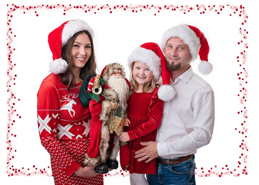 Family holding Santa and smiling for a family photographer Ola Molik Photogrpahy