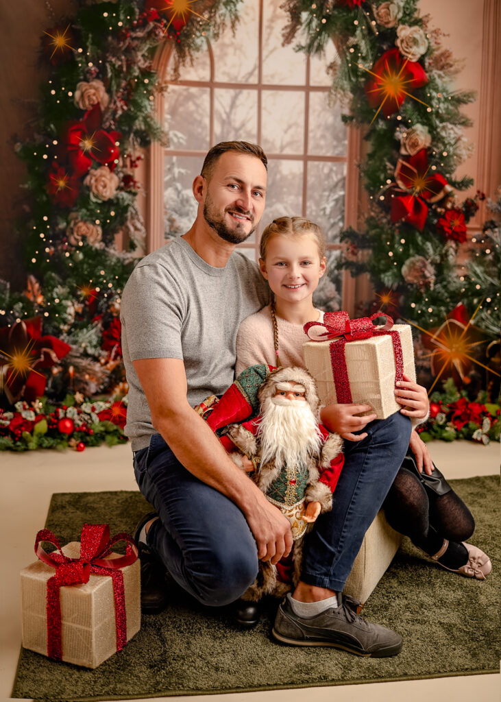 Dad and daughter posing for a photographer during their Christmas Mini Photoshoot with Ola Molik Photography