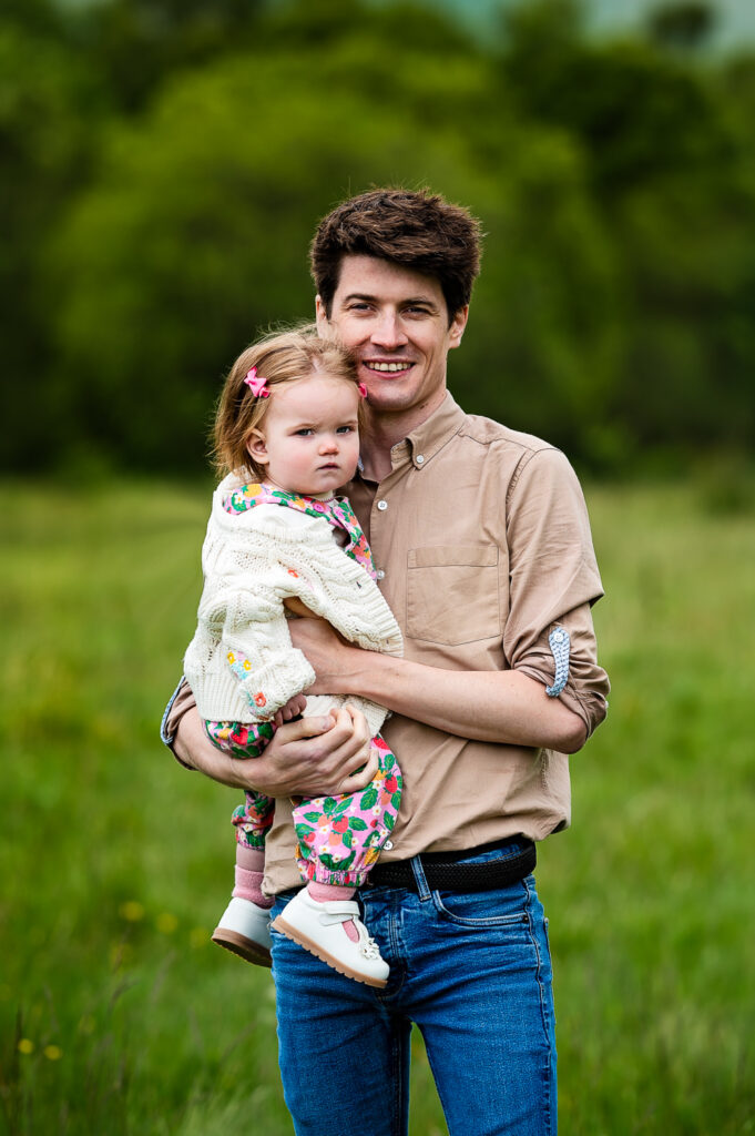 Dad holding his daughter during family photoshoot on location in Mugdock Park Glasgow