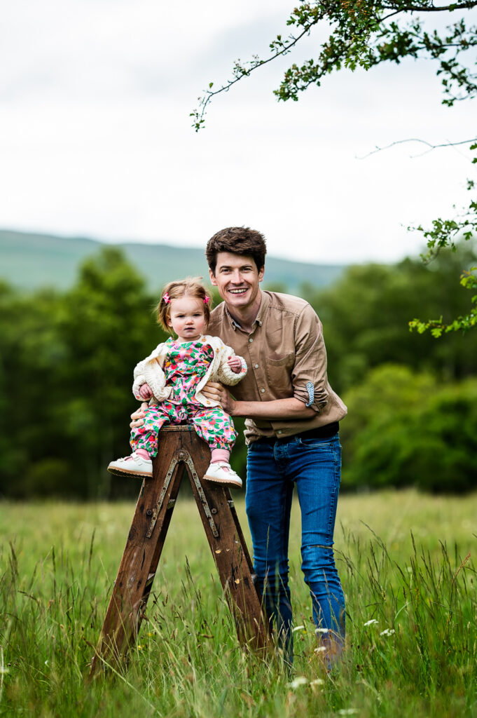 Dad holding his daughter during family photoshoot on location in Mugdock Park Glasgow