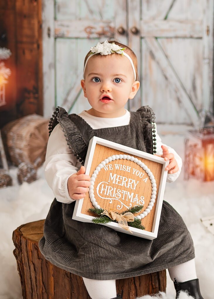 Baby looking at the camera during a  Christmas photoshoot in Glasgow with Ola Molik Photography